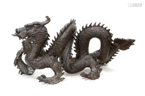 20th century Japanese bronze of a dragon, 42cm high, 84cm lo...