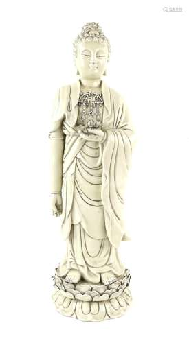 Blanc de chine figure of Buddha on lotus base holding a lotu...