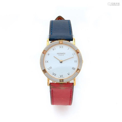 HERMES A stainless steel and gold plated quartz