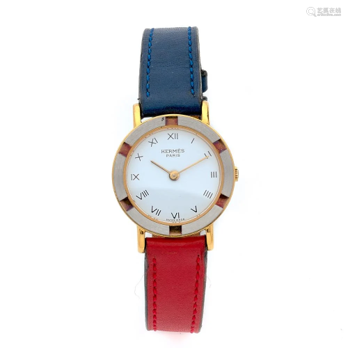 HERMES A stainless steel and gold plated quartz lady's
