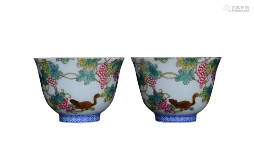 PAIR OF PAINTED ENAMEL 'SQUIRREL AND GREAP' CUPS