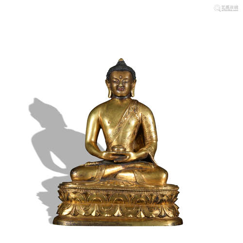 A gilt-bronze statue of Pharmacist Buddha