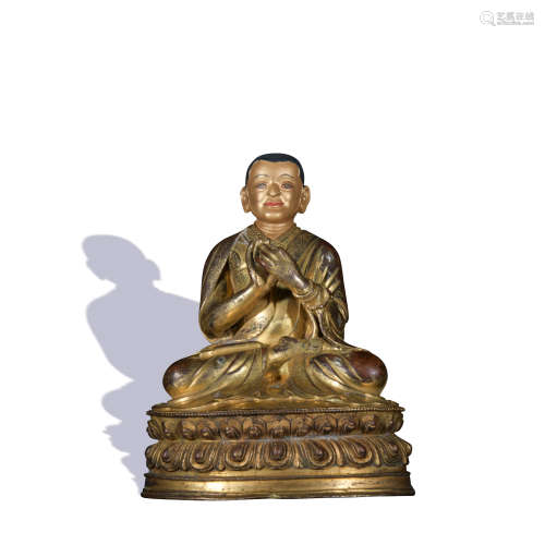 A gilt-bronze statue of Guru