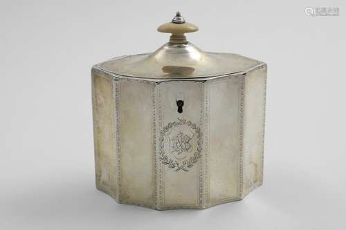 A GEORGE III TEA CADDY with vertically fluted panels around ...