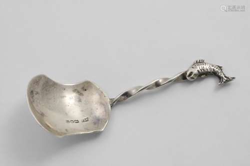 A GEORGE V CADDY SPOON with a waisted shovel bowl, a twist s...