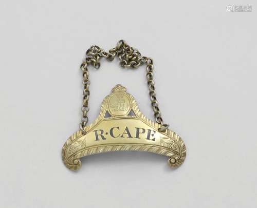 CAPE:- A George III silvergilt wine label with a cartouche s...