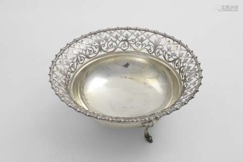A GEORGE V CIRCULAR FRUIT DISH on three legs with a gadroone...