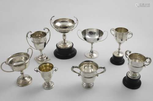 GOLFING TROPHIES:- Eight various 20th century two-handled cu...