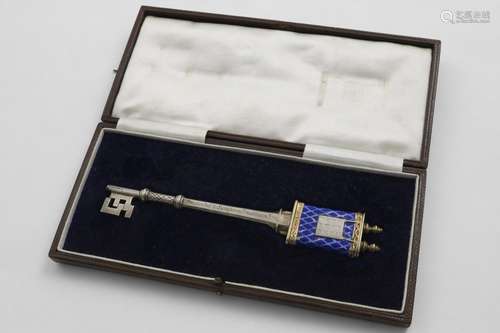 JUDAICA:- A George V parcelgilt and enamelled presentation k...