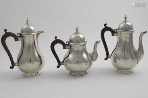 A GEORGE V TEA POT, COFFEE POT & HOT WATER JUG with baluster...