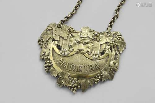 BY PAUL STORR:- A George III cast silvergilt wine label in t...