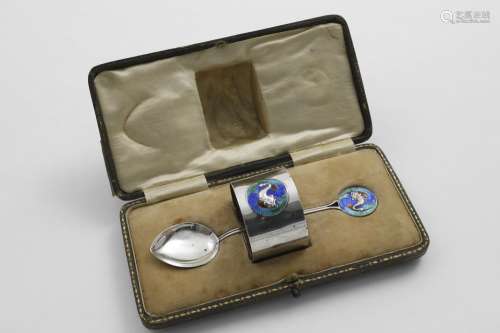 AN EDWARDIAN CASED NAPKIN RING AND SPOON each decorated with...
