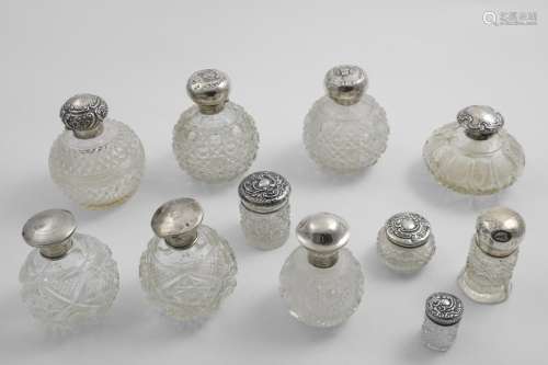 ELEVEN VARIOUS MOUNTED CUT-GLASS DRESSING TABLE BOTTLES AND ...