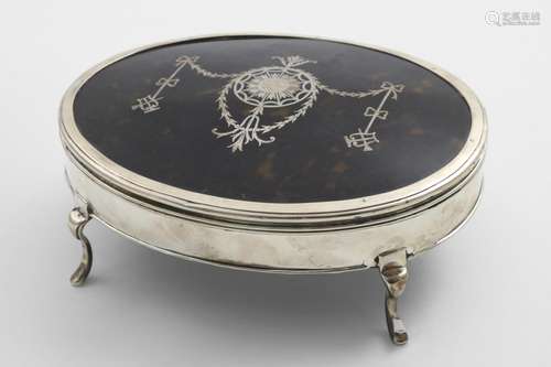 A GEORGE V OVAL DRESSING TABLE BOX on four legs with an inla...