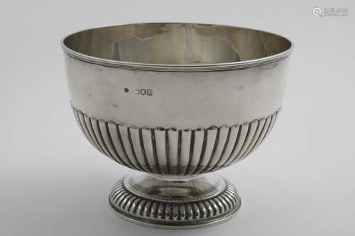 AN EDWARDIAN PART-FLUTED ROSE BOWL on a domed foot, by Messr...