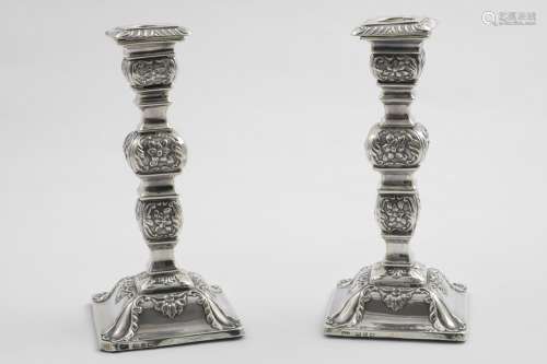 A PAIR OF LATE VICTORIAN CANDLESTICKS on domed square bases,...