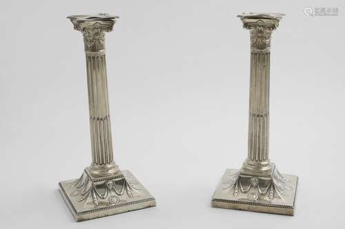 A PAIR OF LATE VICTORIAN NEO-CLASSICAL CANDLESTICKS with flu...