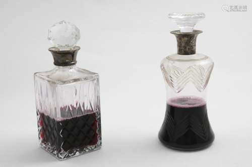 A GEORGE V MOUNTED CUT-GLASS DECANTER & STOPPER with a waist...