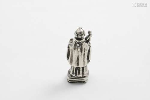 A SMALL CONTINENTAL CAST FIGURE OF A FRANCISCAN FRIAR with t...