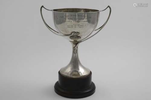 A GEORGE V TWO-HANDLED TROPHY CUP inscribed, by Edward Barna...