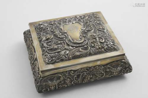 A LATE VICTORIAN EMBOSSED RECTANGULAR DRESSING TABLE BOX wit...