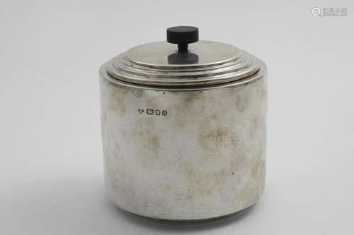 AN ART DECO BISCUIT BOX AND COVER plain cylindrical with ste...