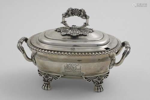 A GEORGE III SAUCE TUREEN & COVER on winged paw feet with an...