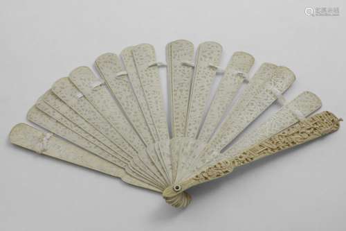 A 19TH CENTURY CHINESE BRISE IVORY FAN with carved end stick...