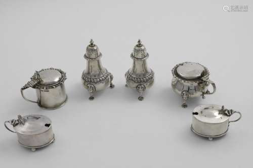 CONDIMENTS:- A pair of George V pepper casters and matching ...