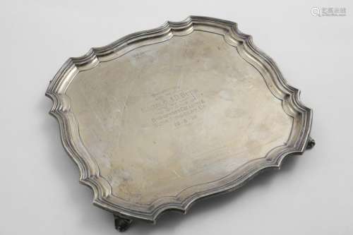 A GEORGE V SALVER of shaped square outline with a moulded bo...
