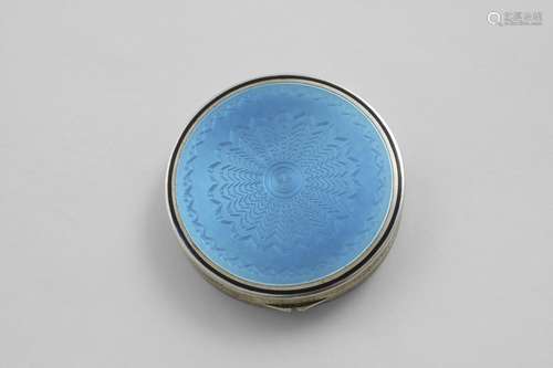 AN ART DECO CIRCULAR COMPACT decorated with translucent ligh...