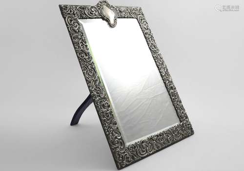 A LATE VICTORIAN RECTANGULAR MOUNTED DRESSING TABLE MIRROR w...