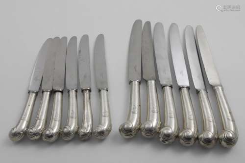 A SET OF SIX GEORGE II TABLE KNIVES AND FIVE SIDE KNIVES wit...