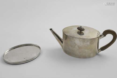 A GEORGE III TEA POT plain oval with a flat base and taperin...