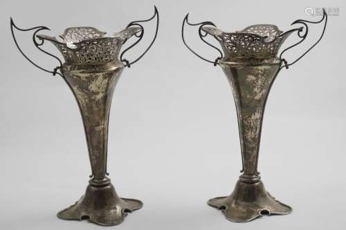 A PAIR OF EDWARDIAN ART NOUVEAU VASES on shaped, domed bases...