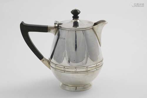 A GEORGE V HOT WATER JUG with an egg-shaped body, an angular...