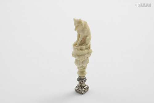 A VICTORIAN MOUNTED CARVED IVORY SEAL in the form of a fox, ...