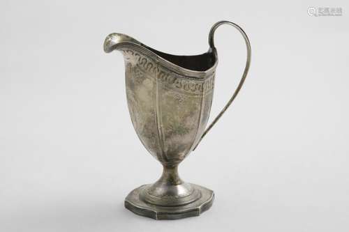 A GEORGE III PEDESTAL CREAM JUG with an engraved, hexagonal ...