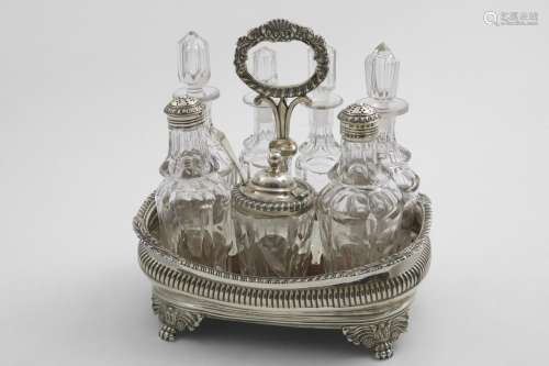 A GEORGE IV BOAT-SHAPED CRUET FRAME with part-fluted sides, ...