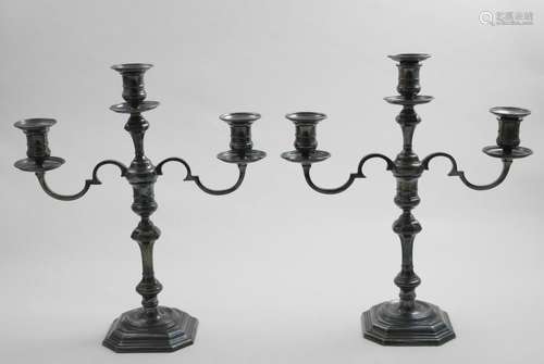 A PAIR OF ELIZABETH II THREE-LIGHT CANDELABRA on canted squa...