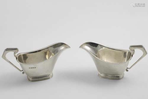 A PAIR OF ART DECO SAUCE BOATS with angular handles, by W. N...