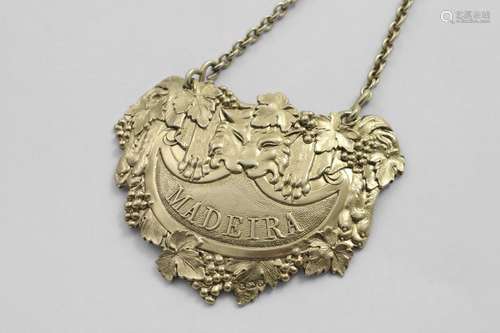 BY PAUL STORR:- A George III cast silvergilt wine label in t...