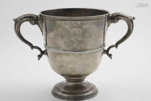 A GEORGE II IRISH TWO-HANDLED CUP with a campana-shaped body...