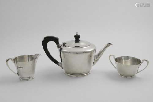 A WWII PERIOD THREE-PIECE TEA SET with plain circular slight...