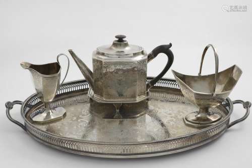A GEORGE III MATCHED FOUR-PIECE TEA SET with bright-engraved...