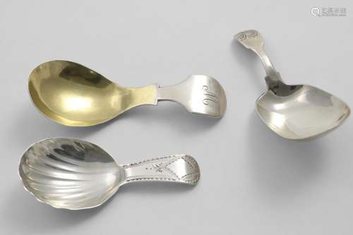 A GEORGE III CADDY SPOON with a fluted bowl and a bright-cut...