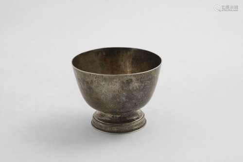 A GEORGE V HAND-MADE SMALL BOWL with a hammered finish, rais...