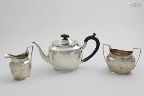 A GEORGE V THREE-PIECE OVAL TEA SET with reeded borders and ...
