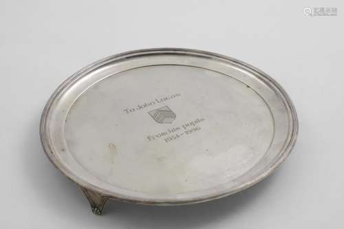 AN ELIZABETH II CIRCULAR SALVER with a reeded border and a s...