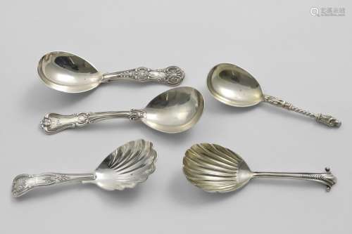 FIVE VICTORIAN CADDY SPOONS with stems displaying a variety ...